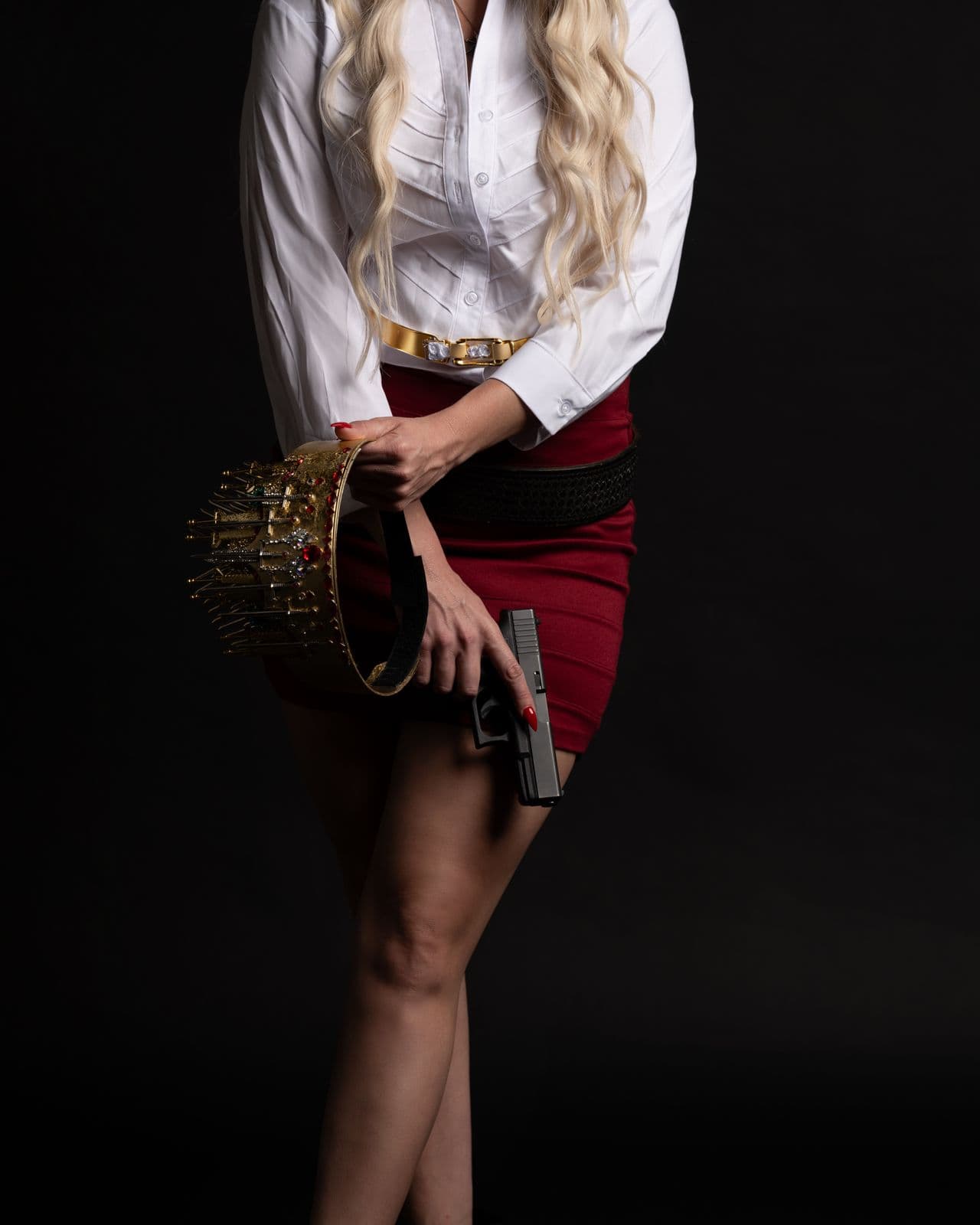 The crown carried low at her side, a pistol in the other hand
